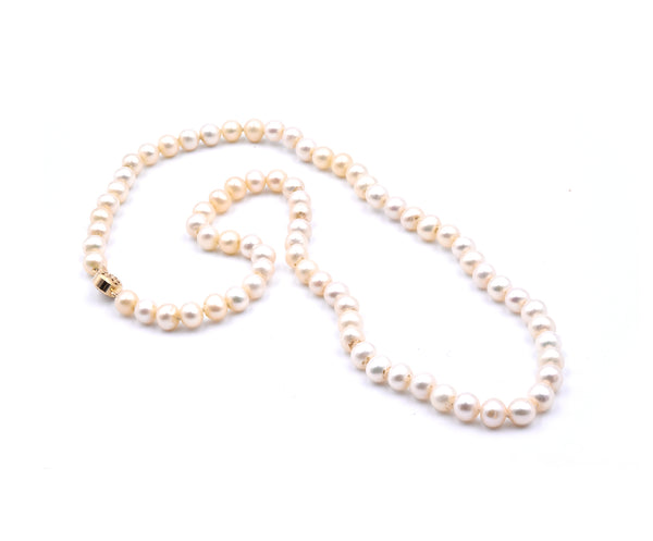 Ivory Semi Round Pearl Strand Necklace with 14 Karat Yellow Gold Clasp