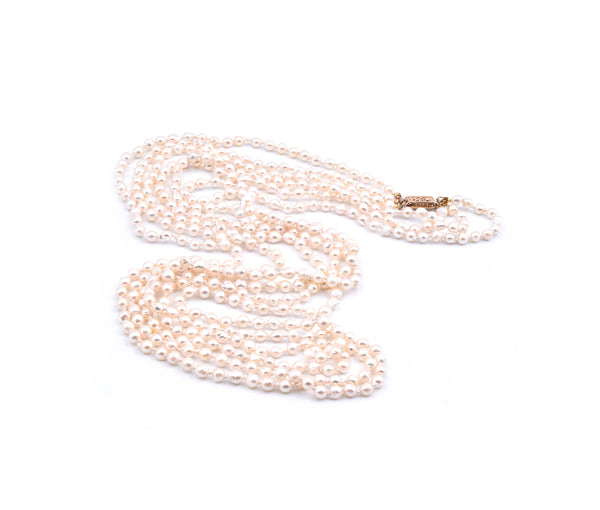 Baroque Seed Pearl Triple Strand Necklace with 14 Karat Yellow Gold Clasp